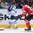 MINSK, BELARUS - MAY 22: Finland's Tuukka Mantyla #18 pulls the puck away from Canada's Braydon Coburn #27 during quarterfinal round action at the 2014 IIHF Ice Hockey World Championship. (Photo by Richard Wolowicz/HHOF-IIHF Images)